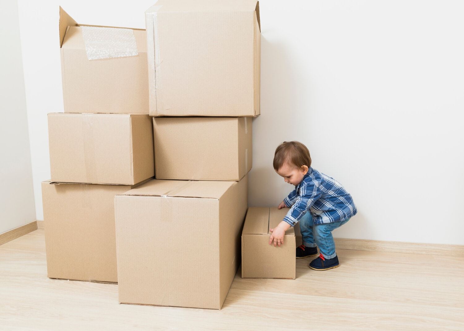 Child with moving boxes